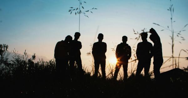 Silhouette of teenagers in a field