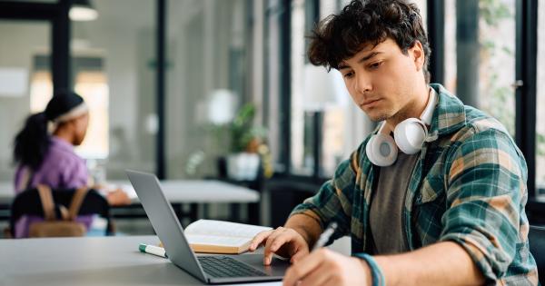 Young male college student with laptop