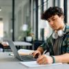 Young male college student with laptop